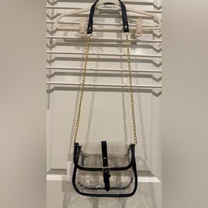 Clear Crossbody Purse with Gold Chain and Black Trim Snap Closure